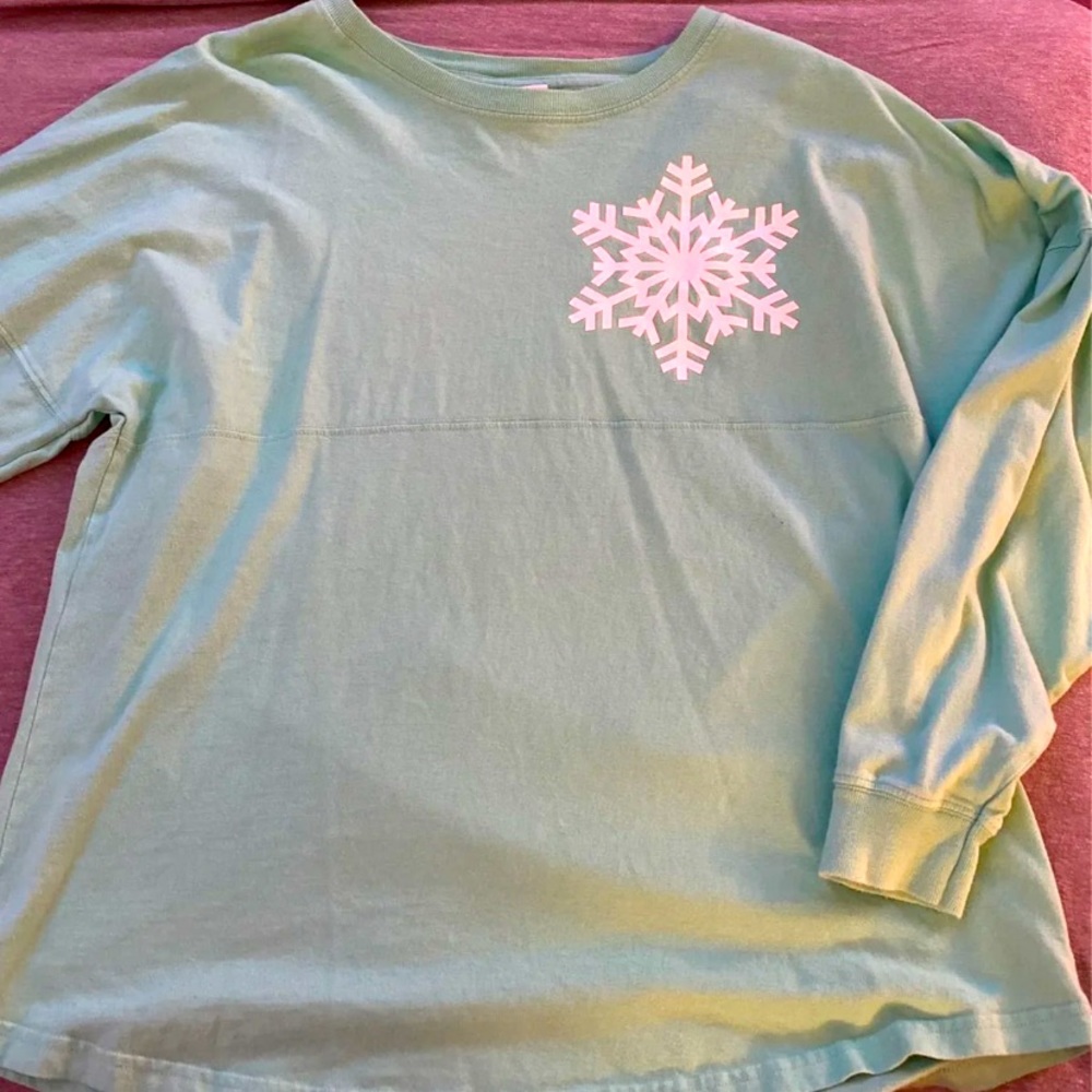 mint green long sleeved shirt